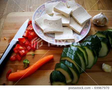 Young Woman Cooking. Healthy Food - Vegetable Salad. Diet. Dieting Concept. Healthy Lifestyle. Cooking At Home. Young Woman Cooking. Healthy Food - Vegetable Salad. Diet. Dieting Concept. Healthy Lifestyle. Cooking At Home. 69967970