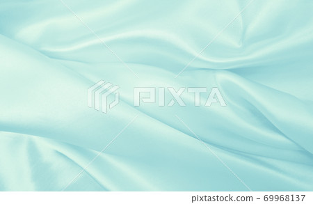 Smooth elegant blue silk or satin luxury cloth texture as abstract background. Luxurious background design Smooth elegant blue silk or satin luxury cloth texture as abstract background. Luxurious background design 69968137
