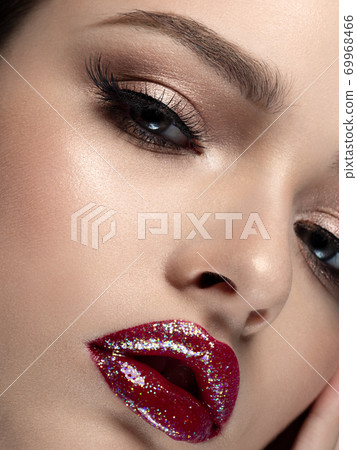 Portrait of young beautiful woman with red lips 69968466