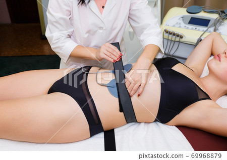 Massage of myostimulation of muscles for weight loss. 69968879