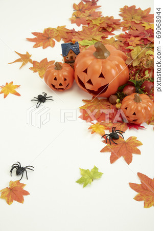 Halloween decorate pumpkins with autumn leaves 69968944