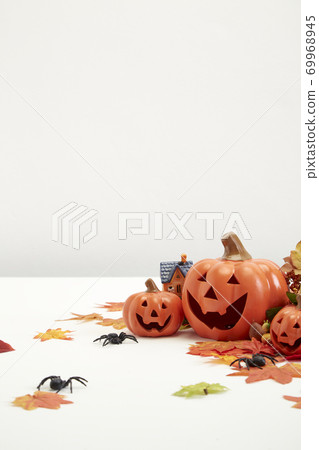 Halloween decorate pumpkins with autumn leaves 69968945