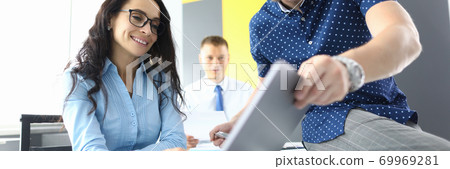 Successful business team are discussing new strategies in office on laptop 69969281