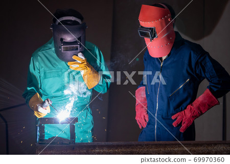 Metal welding steel works using electric arc welding machine Metal welding steel works using electric arc welding machine 69970360