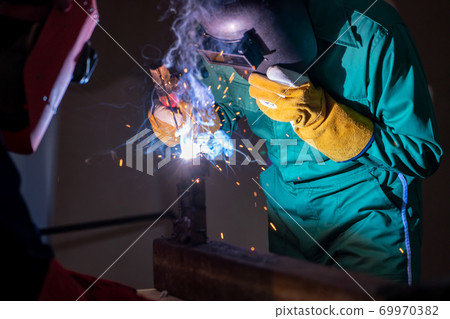 Metal welding steel works using electric arc welding machine Metal welding steel works using electric arc welding machine 69970382