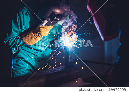 Metal welding steel works using electric arc welding machine Metal welding steel works using electric arc welding machine 69970609