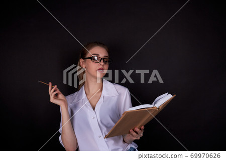 High school girl is reading a book. 69970626