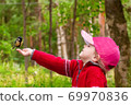 beautiful three-year-old girl in a red sweater 69970836