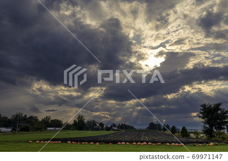 A mysterious landscape where an angel's ladder appears A mysterious landscape where an angel's ladder appears 69971147