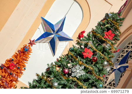 A festive decoration of a Christmas tree and five-pointed star. A festive decoration of a Christmas tree and five-pointed star. 69971279