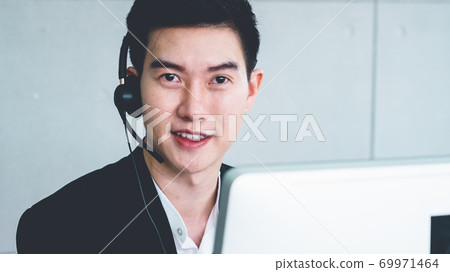 Business people wearing headset working in office 69971464