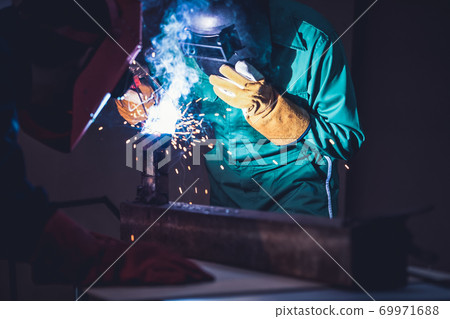Metal welding steel works using electric arc welding machine Metal welding steel works using electric arc welding machine 69971688