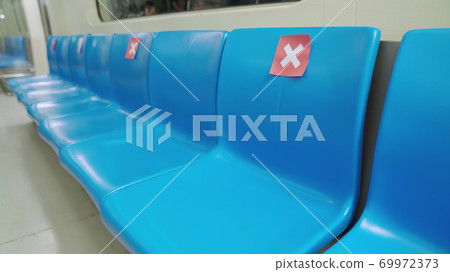 Seat on public in public underground metro with social distancing signs Seat on public in public underground metro with social distancing signs 69972373