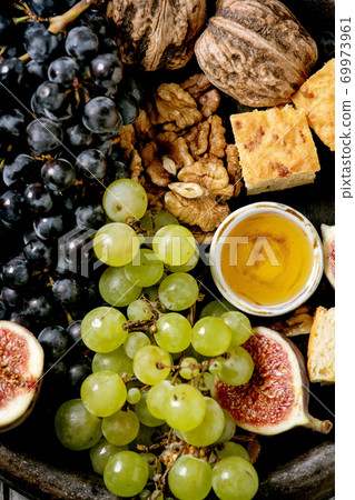 Wine appetizers with grapes Wine appetizers with grapes 69973961