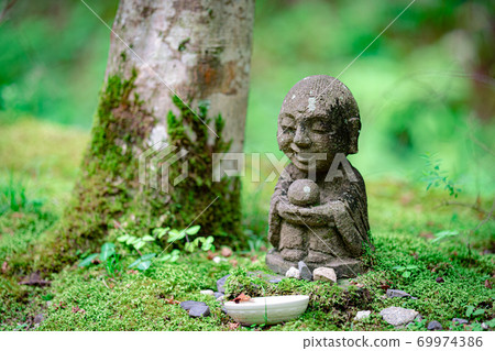 Jizo in a mossy forest Jizo in a mossy forest 69974386