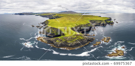 Aerial view of wild coast by Glencolumbkille in County Donegal, Irleand. Aerial view of wild coast by Glencolumbkille in County Donegal, Irleand. 69975367
