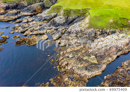Aerial view of wild coast by Glencolumbkille in County Donegal, Irleand. Aerial view of wild coast by Glencolumbkille in County Donegal, Irleand. 69975409