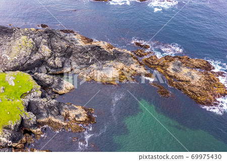 Aerial view of wild coast by Glencolumbkille in County Donegal, Irleand. Aerial view of wild coast by Glencolumbkille in County Donegal, Irleand. 69975430