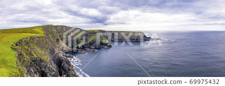 Aerial view of wild coast by Glencolumbkille in County Donegal, Irleand. Aerial view of wild coast by Glencolumbkille in County Donegal, Irleand. 69975432