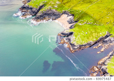 Aerial view of wild coast by Glencolumbkille in County Donegal, Irleand. Aerial view of wild coast by Glencolumbkille in County Donegal, Irleand. 69975487