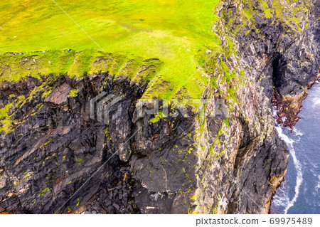 Aerial view of wild coast by Glencolumbkille in County Donegal, Irleand. Aerial view of wild coast by Glencolumbkille in County Donegal, Irleand. 69975489