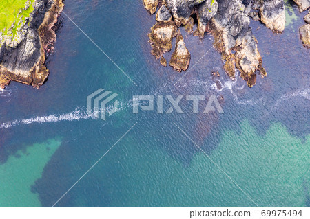 Aerial view of wild coast by Glencolumbkille in County Donegal, Irleand. Aerial view of wild coast by Glencolumbkille in County Donegal, Irleand. 69975494