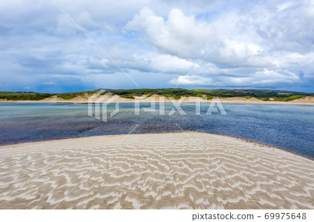 Beautiful beach in Sheskinmore bay between Ardara and Portnoo in Donegal - Ireland 69975648