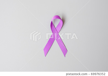 Pancreatic Cancer, world Alzheimer, epilepsy, lupus and domestic violence day Awareness month, Woman holding purple Ribbon for supporting people living. Healthcare and World cancer day concept 69976352