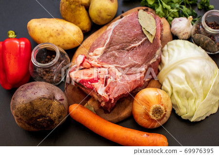 ingredients for borscht on the kitchen table. Homemade Russian, Ukrainian national soup - red borscht ingredients for borscht on the kitchen table. Homemade Russian, Ukrainian national soup - red borscht 69976395