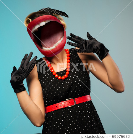Portrait of beautiful young surprised woman, dressed in pin-up style. Portrait of beautiful young surprised woman, dressed in pin-up style. 69976683