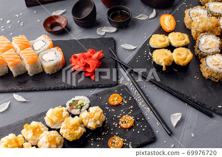 Various kinds of sushi served on black stone. Sushi set. flat lay, top view 69976720