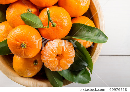 Delicious and beautiful mini Tangerines Delicious and beautiful mini Tangerines 69976838