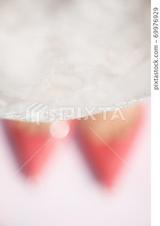 Pink Court Shoes and Lace Dress on Pink Background Pink Court Shoes and Lace Dress on Pink Background 69976929