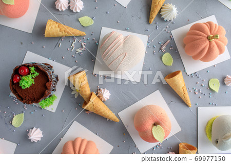 assortment of cake. Cake in the form of a heart, Apple, pumpkin, Bunny. Top view  69977150