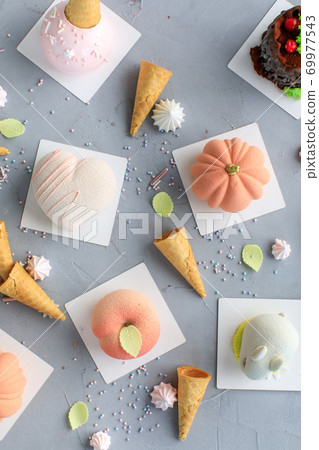 flatlay on a gray background pastry pumpkin and waffle cone flatlay on a gray background pastry pumpkin and waffle cone 69977543