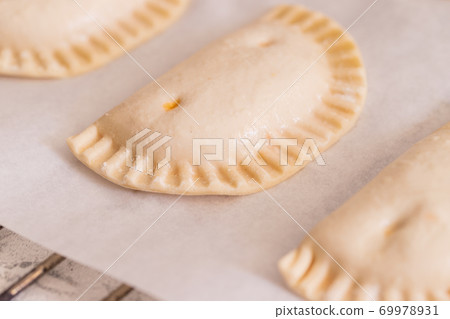 Spanish snack Empanadillas 69978931