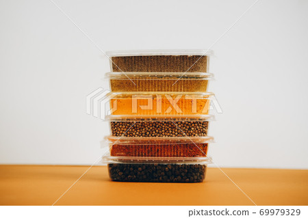 Frame made of colorful green, yellow and red penne pasta naturally coloured with tomato and spinach. 69979329