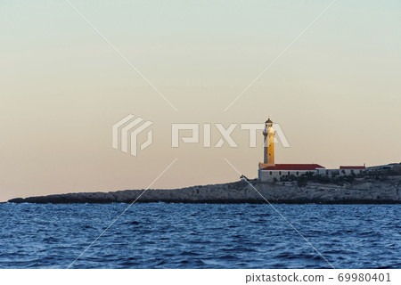 Lighthouse on the island of Vis in the Mediterranean sea Lighthouse on the island of Vis in the Mediterranean sea 69980401