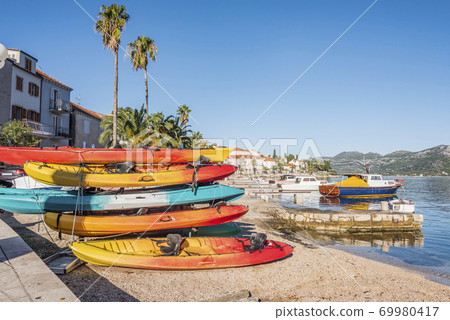 Colored boats on the island of Korcula in the Mediterranean sea Colored boats on the island of Korcula in the Mediterranean sea 69980417