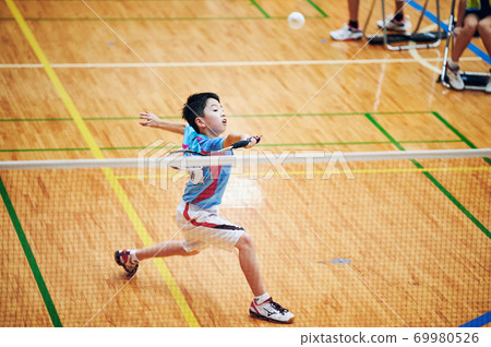 Elementary school boys playing badminton games 69980526