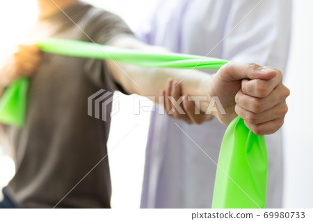 Professional therapists are stretching muscles, patients with abnormal muscular symptoms, physical rehabilitation therapies and treatment of physiological disorders by physiotherapists concept. 69980733