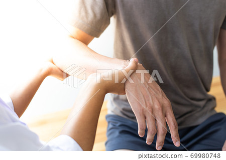 Professional therapists are stretching muscles, patients with abnormal muscular symptoms, physical rehabilitation therapies and treatment of physiological disorders by physiotherapists concept. 69980748