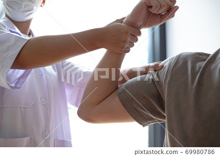 Professional therapists are stretching muscles, patients with abnormal muscular symptoms, physical rehabilitation therapies and treatment of physiological disorders by physiotherapists concept. 69980786