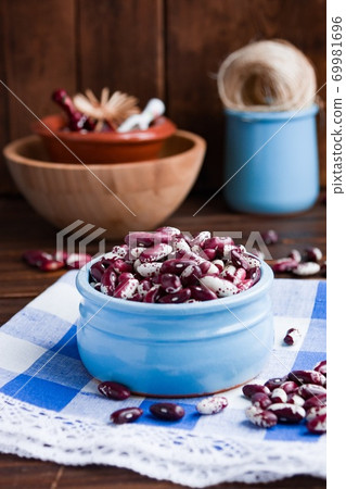 Violet with dots beans in ceramic bowl. Swallow beans. Vegetables for healthy eating. Organic food. 69981696