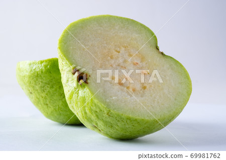 Guava cut in half and put it on a white background.fruit on white backdrop. 69981762