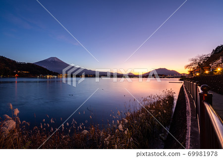 Aerial Panorama Landscape of Fuji Mountain. Iconic and Symbolic Mountain of Japan. Scenic Sunset Landscape of Fujisan at Evening Time, Kawaguchiko, Yamanashi, Japan. Aerial Panorama Landscape of Fuji Mountain. Iconic and Symbolic Mountain of Japan. Scenic Sunset Landscape of Fujisan at Evening Time, Kawaguchiko, Yamanashi, Japan. 69981978