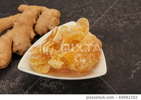 Dry sweet ginger in the bowl 69982302