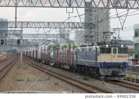 EF65 towed down freight train passing through Maya Station on the Tokaido Main Line EF65 towed down freight train passing through Maya Station on the Tokaido Main Line 69982356