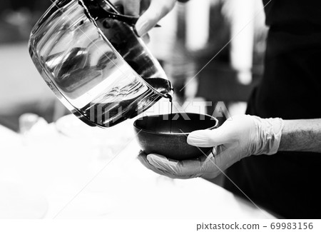 Chef cooking, Chef preparing food in the kitchen, Chef decorating dish, closeup. Chef cooking, Chef preparing food in the kitchen, Chef decorating dish, closeup. 69983156