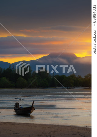 Beautiful sunrise view of beach on longtail boat in Thailand 69984332
